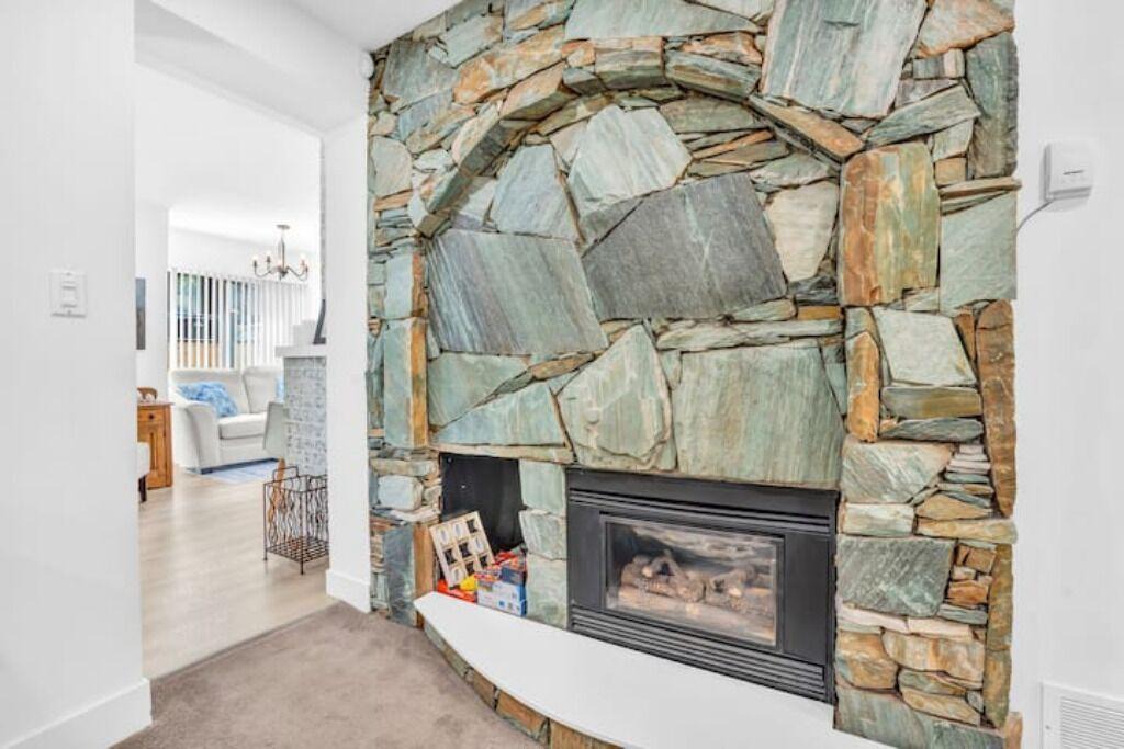 Lynn Valley House | King Bed with front door parking and private courtyard. Designed for living.