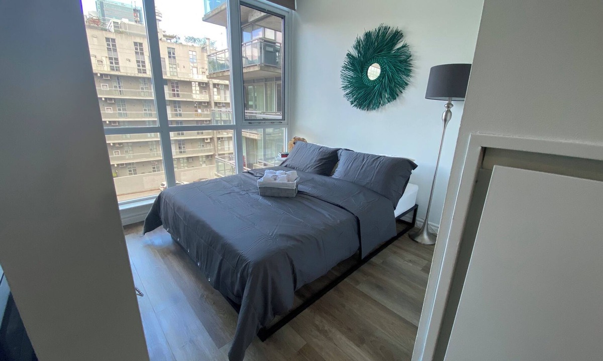 Wellington Place Apartment | King West loft Short term contact host