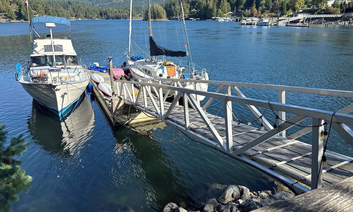 Garden Bay House | Oceanfront property in Pender Harbour with a dock, wrap around balcony with view