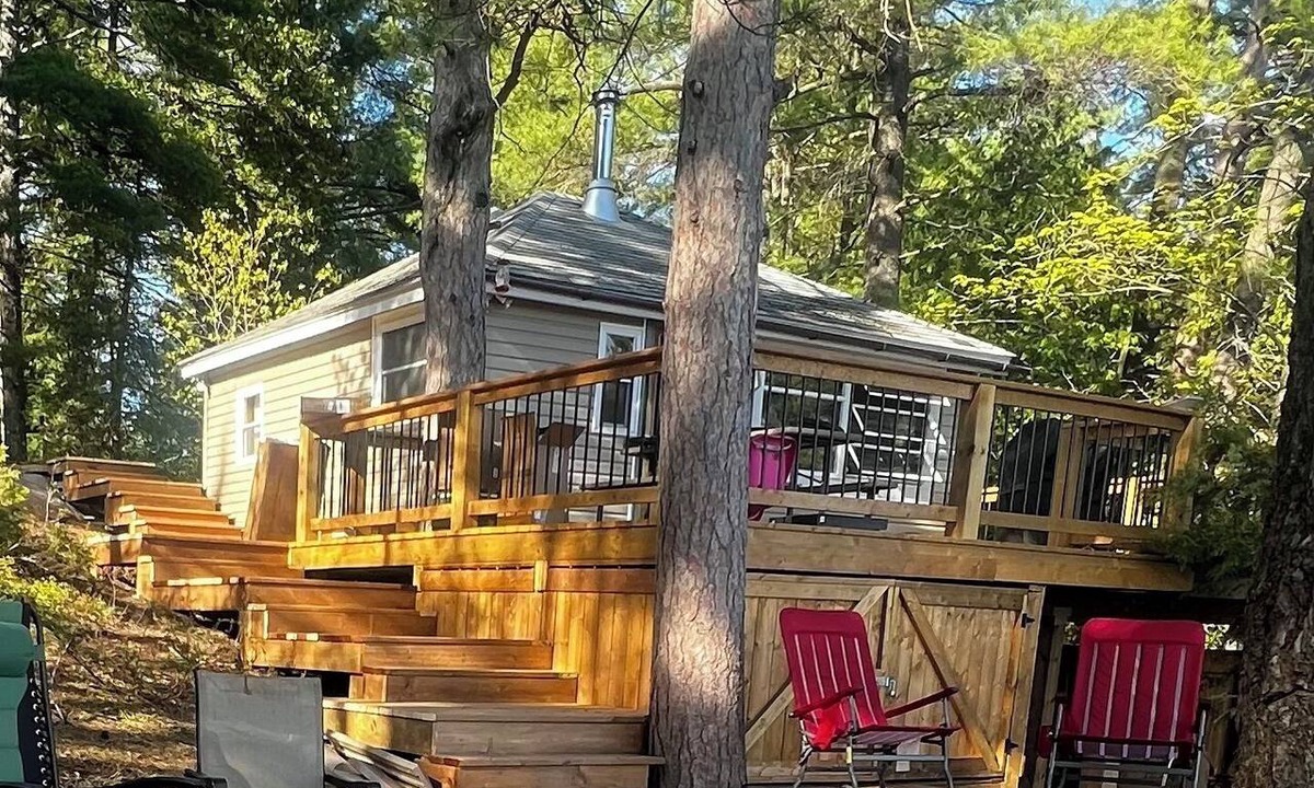 North Frontenac Cottage | Peaceful Lakefront Cottage - Large Deck, Dock & Rustic Outdoor Charm