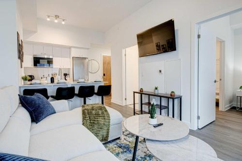 Kitchener House | Stylish Downtown Suite with Patio & City Views