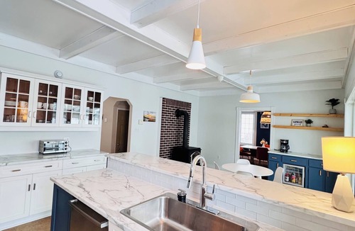 Antigonish House | Charming Sunroom Home with Cozy Living Spaces