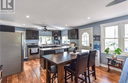 Big Chute Cottage | Cozy Lakeside Cottage Retreat with Kayaks, Paddle Boat & Sunset Waterfront Views