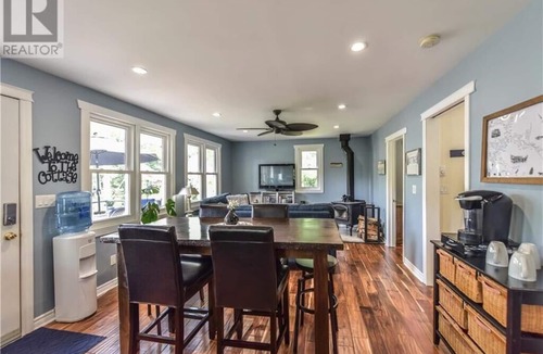 Big Chute Cottage | Cozy Lakeside Cottage Retreat with Kayaks, Paddle Boat & Sunset Waterfront Views
