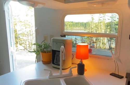 Lepreau House | Cozy waterfront property nestled amongst spruce trees. Pet friendly.