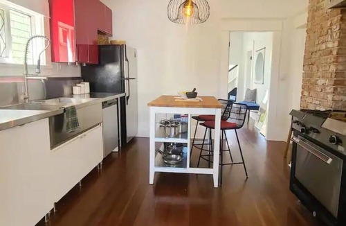 East Side House | Design Heritage Suite | Brick + Private Patio near Commercial Drive