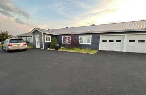 Gloucester County House | Drift into comfort at the Cozy Current. Your lakeside escape awaits you!