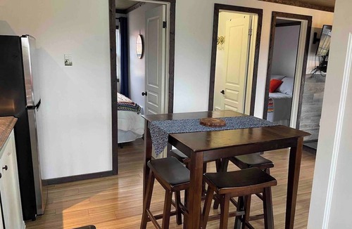 Carbonear Cottage | Escape to The Blue Bird – a cozy 2-bedroom cottage with hot tub and partial ocean views! Just 5 mins from Carbonear & 15 mins to Salmon Cove Sands.