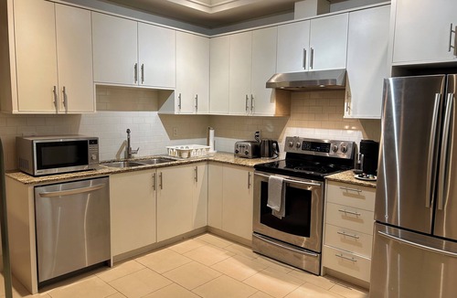 Canyon Heights Apartment | Fern Hollow - unwind in this nature inspired suite in Edgemont Village.
