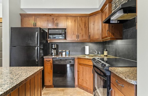 Radium Hot Springs Apartment | Grizzly Springs | Outdoor Pool/Hot Tub | Fireplace