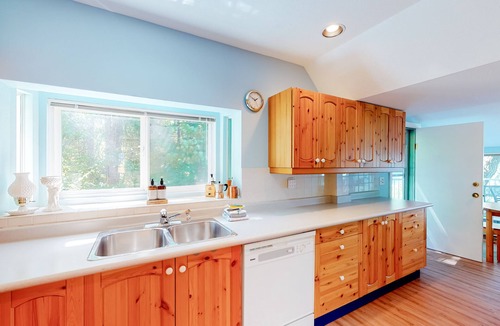 Christina Lake Cabin | Lakefront home with dock, fireplace, washer/dryer, and mountain views - dogs OK