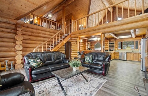 Magna bay Ski Chalet | Lakeview log cabin for family fun - up 20 guests! Beach access, buoy, hot tub.