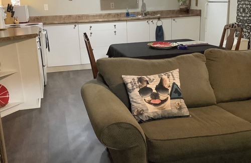 Rosemount Apartment | Large private fenced yard with guest patio, fire pit and surrounding gardens.