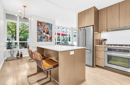 Southeast False Creek House | Location! Modern Urban Oasis with Premium King Size Beds and a Home Office
