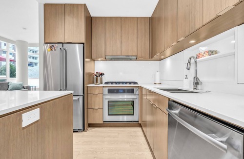 Southeast False Creek House | Location! Modern Urban Oasis with Premium King Size Beds and a Home Office