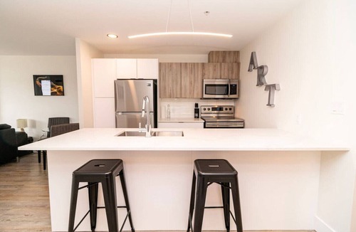 North End Apartment | Modern North End 1BD Suite w/Gym, On-Site Cinema & Workspace