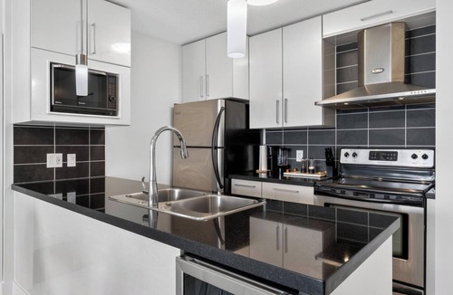 Gastown Condo | Modern & Spacious 2BR + Den Near BC Place Parking Pool