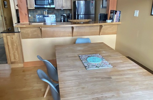Golden House | Mountain views from hot tub in this 3br/2bath ski/bike in home at Kicking Horse
