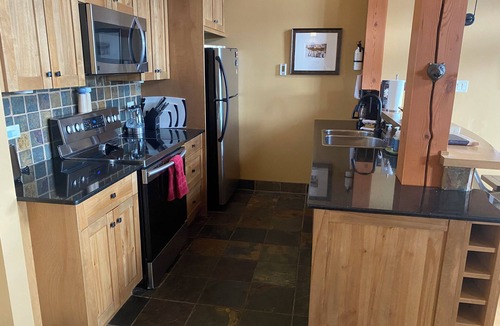 Golden House | Mountain views from hot tub in this 3br/2bath ski/bike in home at Kicking Horse