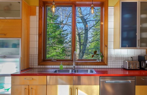 Val David Ski Chalet | Nestled in the heart of nature, La Romane combines contemporary design, warmth, and comfort — featuring a private spa year-round, billiard room, and a heated pool in summer.