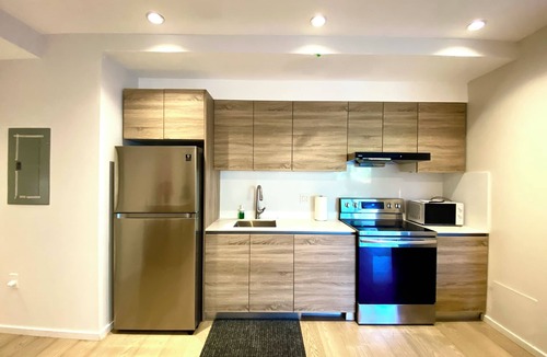 Hollyburn House | New Central Ambleside Garden suite in We st Van couver