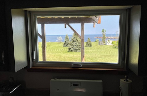 Cormierville House | Oceanfront paradise, 4-bedroom house in Cocagne with hot tub, WiFi, AC.