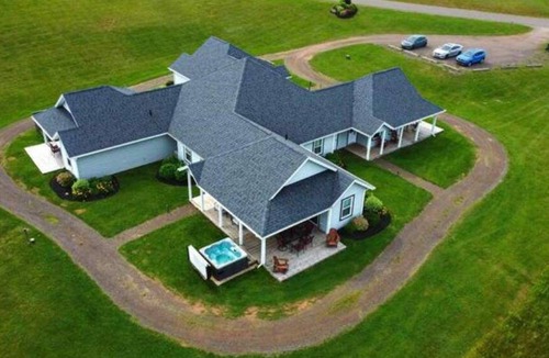 Stanley Bridge House | Private hot tub, secluded golf view villa. Pet Friendly!