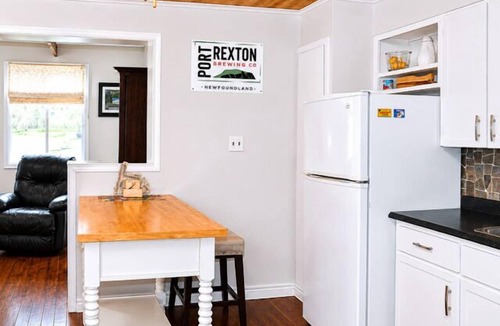 Port Rexton House | Relax at The Bonavista Branch House - Port Rexton, a cozy 2BR retreat near Skerwink Trail and Trailway. Once home to railway engineers and conductors, this updated cottage offers firepit evenings, local dining, Port Rexton Brewing, and Nfld charm.