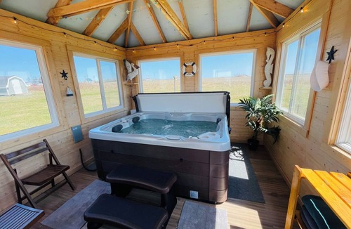 Darnley Cottage | Rest Ashored in Anne's land!- Hot tub, Kayaks Centrally located, stunning views.