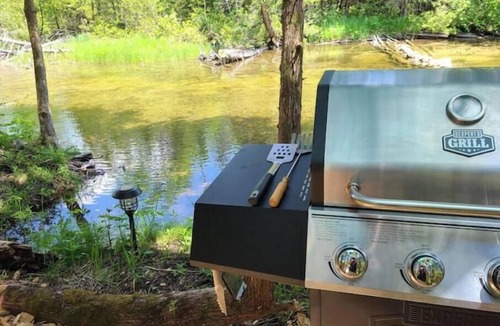 Chatsworth Cabin | Riverside Retreat waterfront Luxury Glamping King size bed and very private