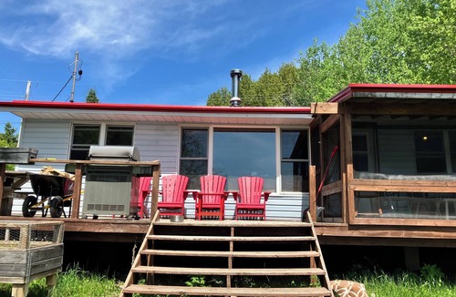 Trent Lakes Cottage | Rustic Waterfront Cottage -3 Bedroom,Sunset Views,Screened in Porch,Firepit,BBQ