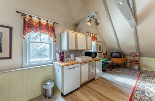 Saint Patrick Cottage | Spacious Loft Suite in Historic Carriage House w/Private Deck