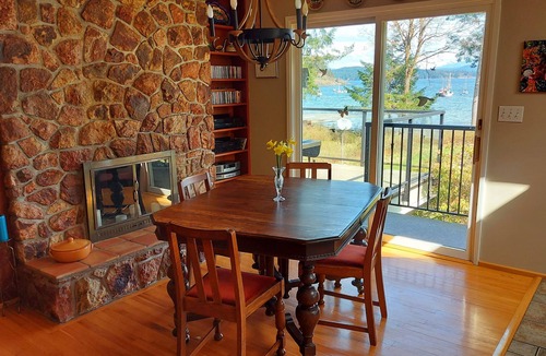 Heriot Bay House | Spectacular beach front property with stunning view of coastal mountains.