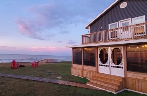 French Village House | Three Bedroom Home With Screened In Porch Only Steps Away From North Shore Beach
