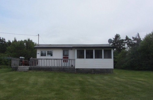 Morell Cottage | Two Bedroom Cottage With Open Concept Leading To Large Patio And Screened Porch.