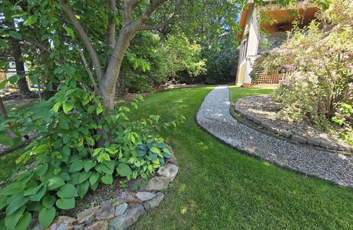 Central Okanagan House | Work or play, relax in your own private hot tub or kick back and watch a movie!