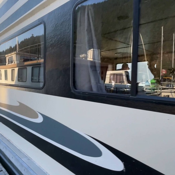 Experience the ultimate waterfront escape on our stunning Three Buoys Houseboat