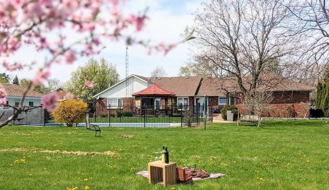 A poolside guest stay nested in a beautiful orchard along winery route
