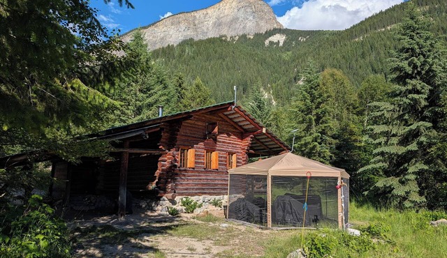 A Swiss chalet styled cabin in the woods with rustic charm. A peaceful getaway.