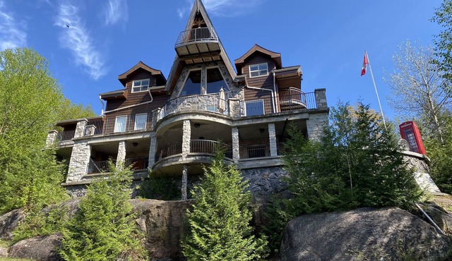 Breathtaking views from rustic cottage atop the Edge of Kennisis Lakes!