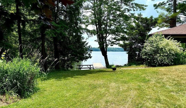 Charming waterfront retreat nestled on the serene shores of Oak Lake.