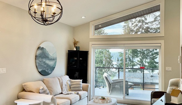 Contemporary lake cottage steps from private beach, dock & trails