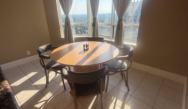 Corner unit 3-bedroom, 3-bath condo with gym, pool, parking, and CN Tower view.