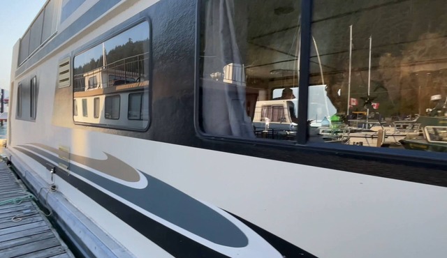 Experience the ultimate waterfront escape on our stunning Three Buoys Houseboat