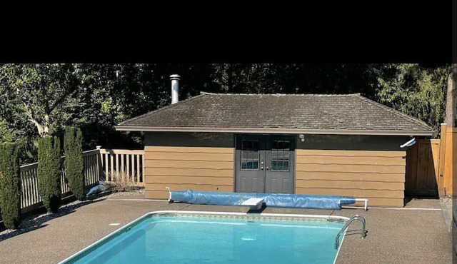 Italian theme villa with outdoor pool sitting on huge acreage lot.