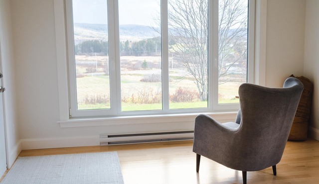 Modern style home with spectacular views of the Margaree River.