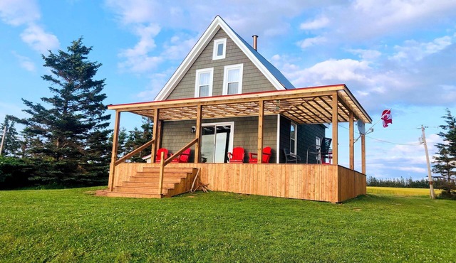 Ocean-front cottage on private, treed lot.