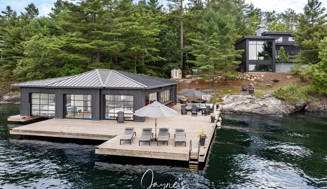 Outstanding 5 bed 6 bath cottage on Lake Joseph with Tennis Studio