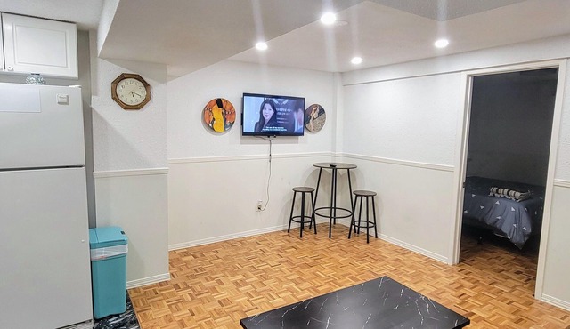 Private 2-bed basement apartment with kitchen & bath. Shared laundry.