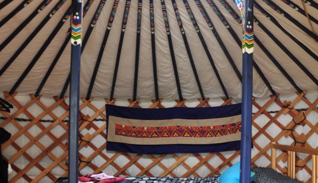 Small blue yurt at Cabot Shores Wilderness Resort